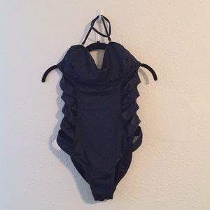 One piece swim suit with cut-outs